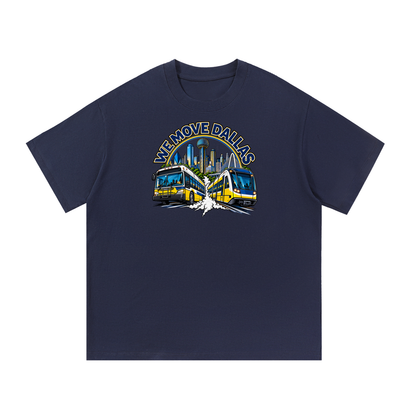 We Move Dallas Tee — navy heavyweight cotton with the DAL transit badge featuring the Dallas skyline, DART train, and bus, printed on the front.