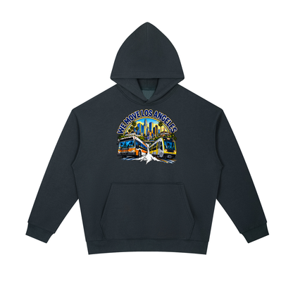 We Move Los Angeles Pullover Hoodie — navy heavyweight brushed fleece with the LA transit badge printed on left chest and full back, featuring the LA skyline, Metro train, and bus.
